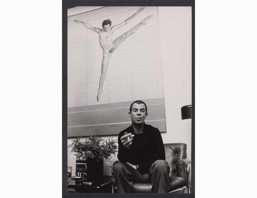 Hans van Manen at home, in front of a painting featuring Gérard Lemaître in Mutations